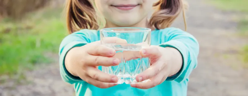 Little Girl With Glass Of Water